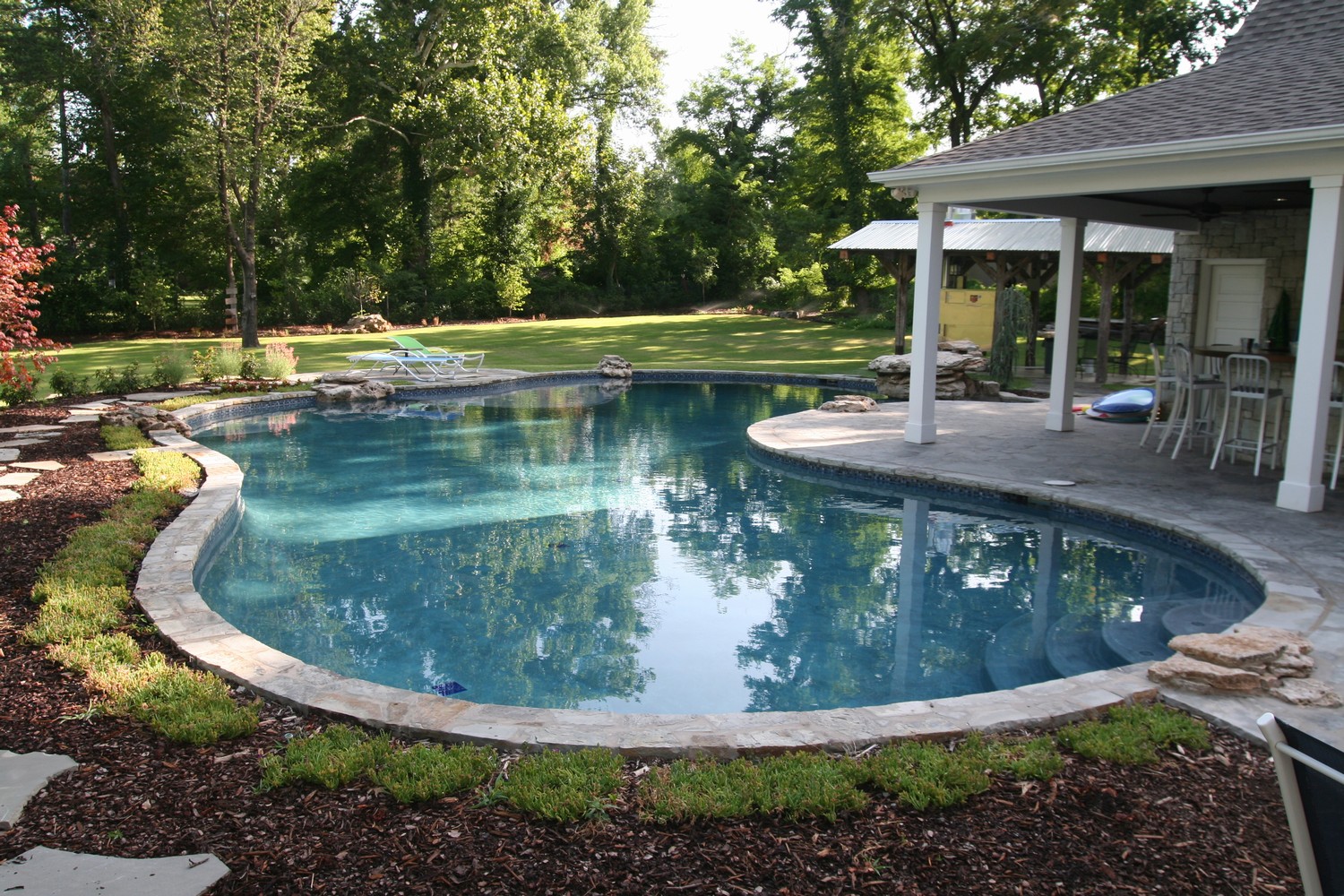 Free-form pools by Atlantis Pools & Spas Inc, Tulsa, Ok.